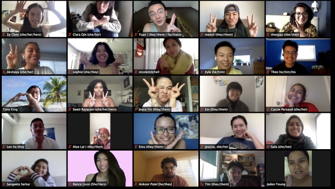 Image description: Zoom screenshot of 25 smiling faces. Some are holding up peace signs and heart signs.