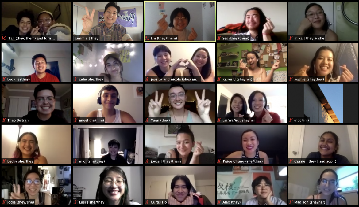 Image description: Zoom selfie with 25+ smiling people. Some are making peace signs and hearts with their hands.