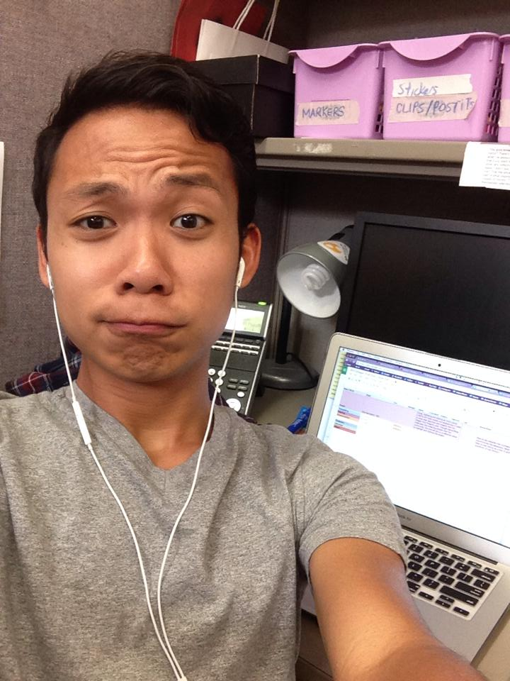 Image Description: back in 2014, Rey Rey taking a silly selfie in the old cubicle office at APIENC.