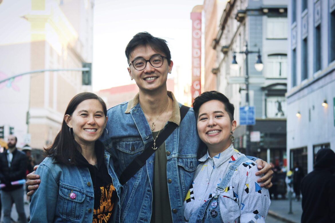 Image: Yuan at Trans March in 2019, alongisde Jasmin & Sammie.